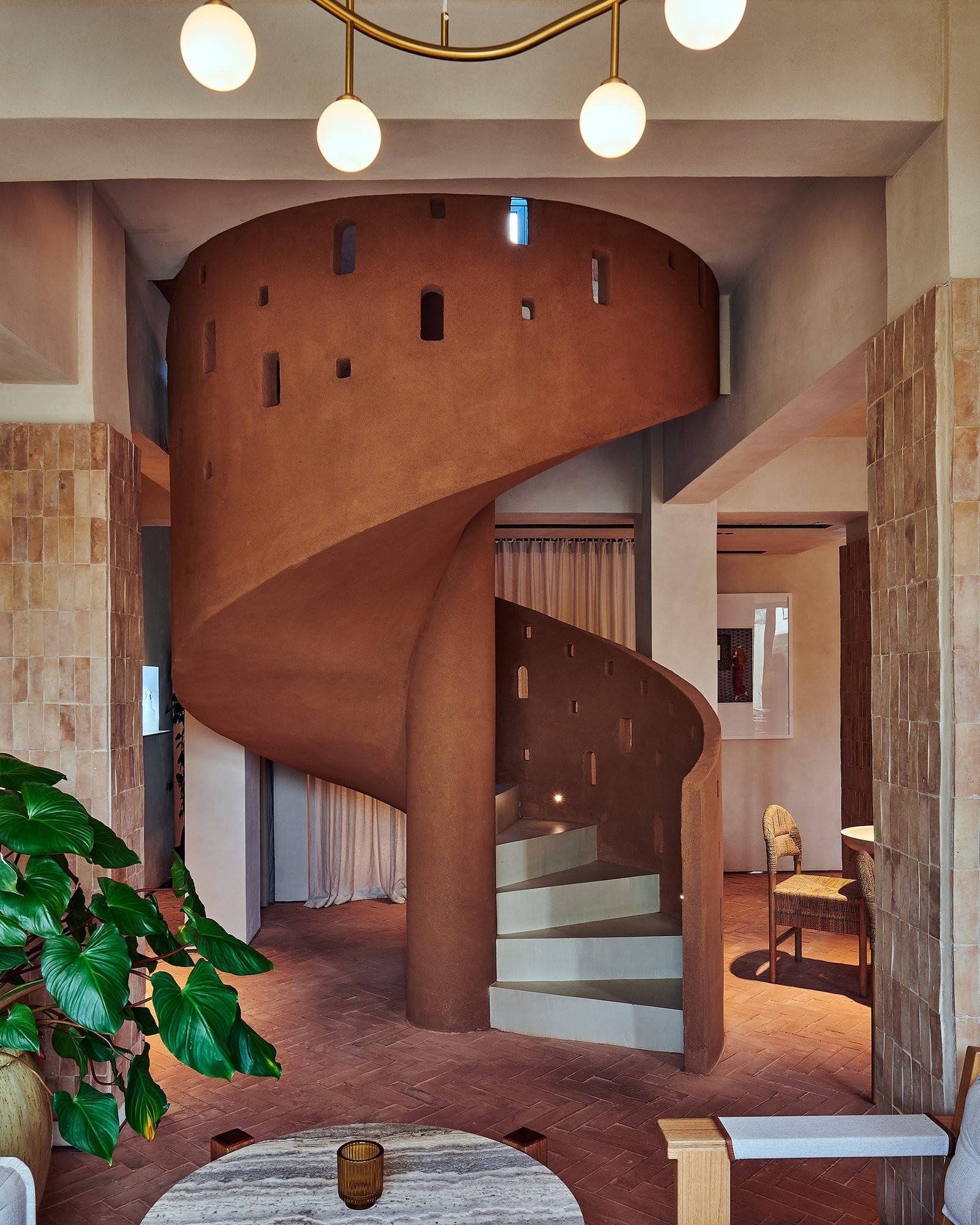 Demi Rustic clay plaster on the spiral stair at Villa 515, Dubai